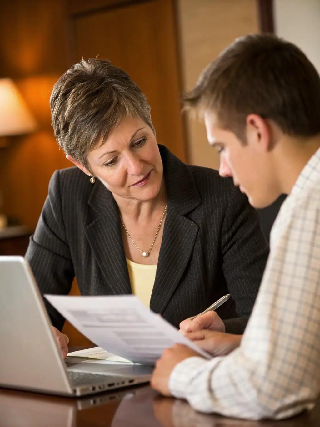 A professional financial advisor explaining the benefits of a fixed annuity to a client in a modern office setting, emphasizing stability and guaranteed returns.